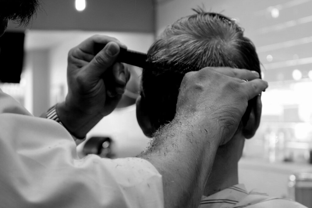 Barber cutting a customer’s hair