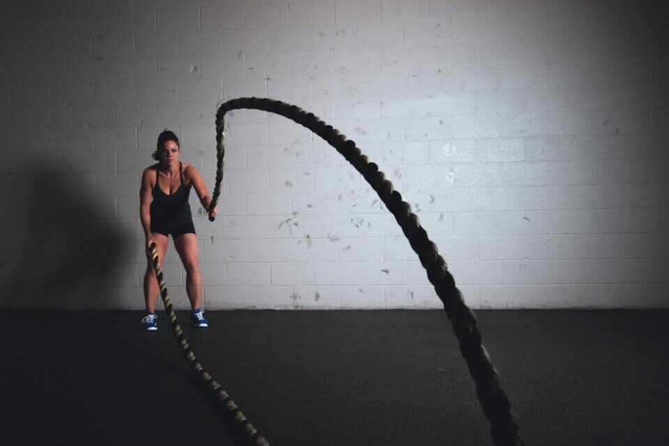 Person training with battle ropes