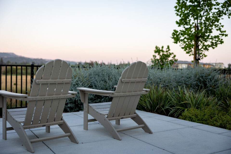 Two chairs beside a planted patio