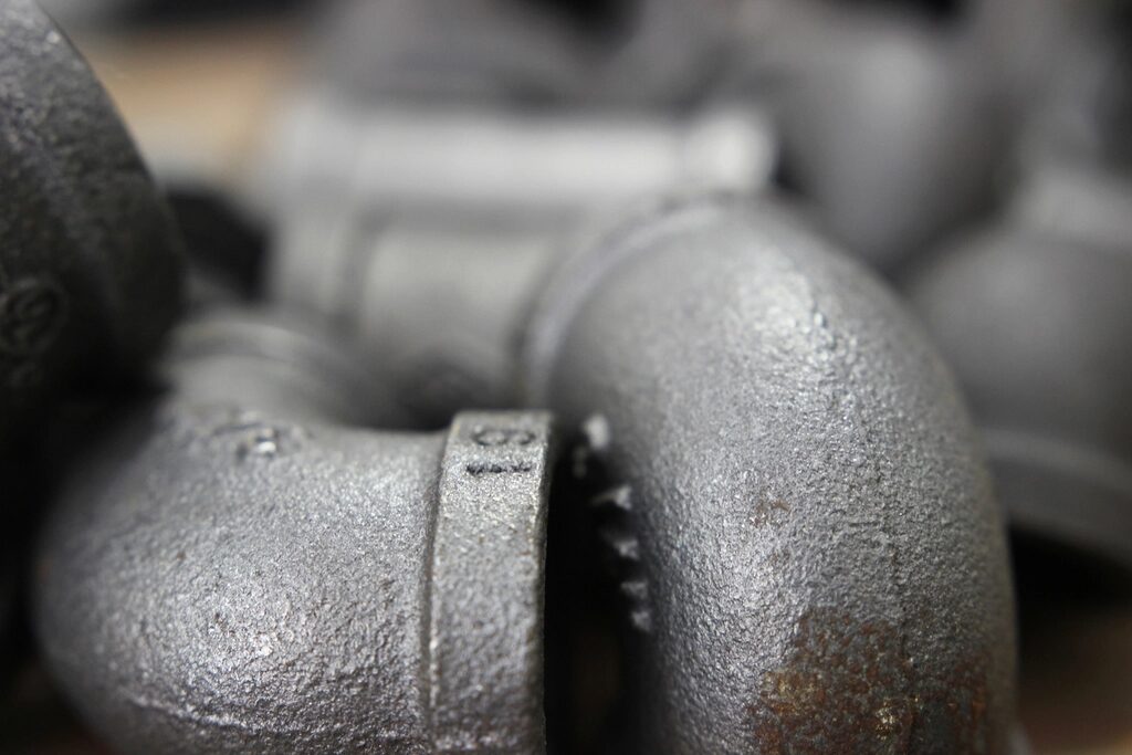Close view of threaded metal pipe elbows