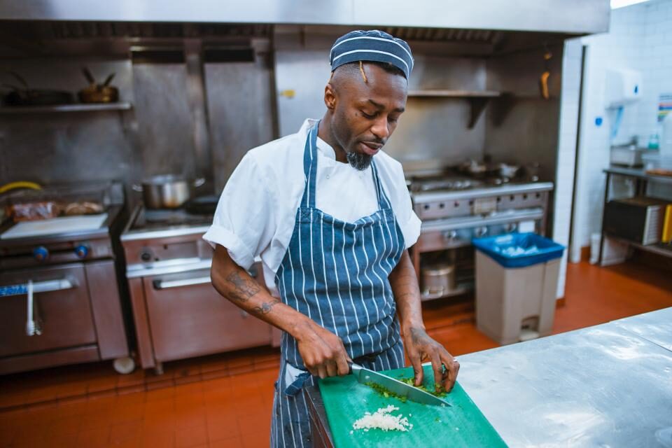 Chef preparing ingredients in a kitchen